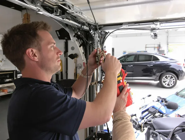 Brighton Garage Door Repair safety certified technician performing cable replacement in Brighton